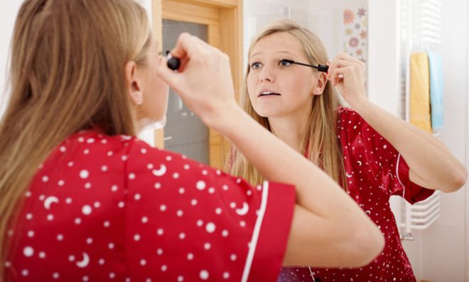 Girl applying makeup