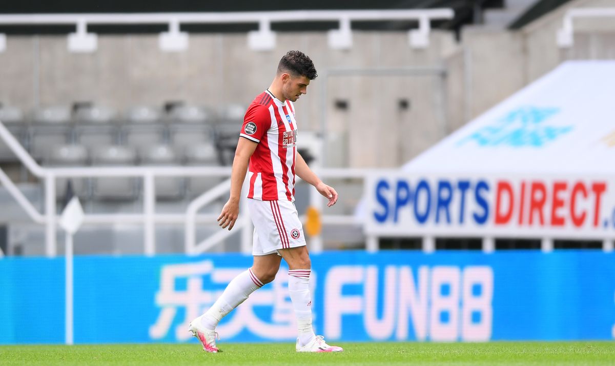 John Egan was sent off as Sheffield United were soundly beaten at Newcastle.