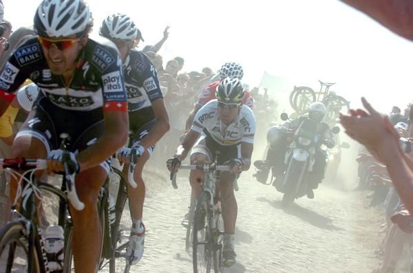 Fabian Cancellara leads Saxo Bank teammate Andy Schleck and world champion Cadel Evans (BMC) on the cobbles.