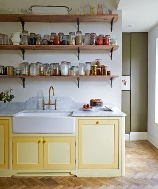 Rustic kitchen with yellow cabinets and open shelves