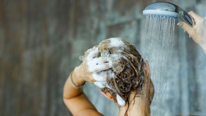 woman washing hair in the shower