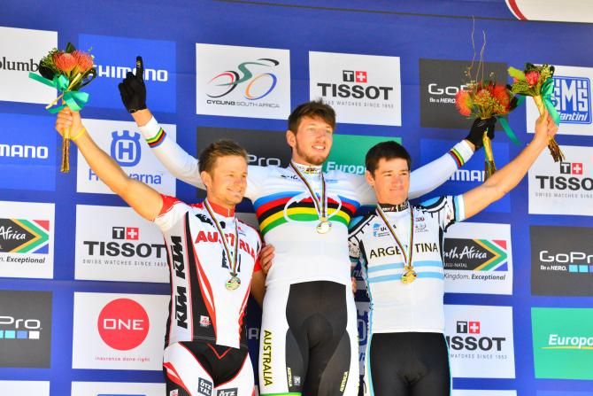Australian Paul Van der Ploeg is flanked by silver medalist Daniel Federspiel (left) and Castriel Andres Soto (right) after the men's eliminator final