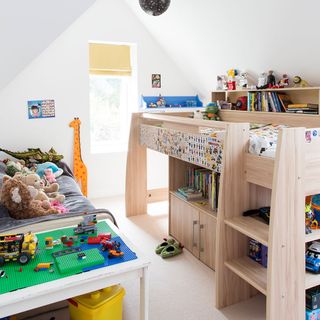 kids bedroom with wooden bunk bed with integrated storage
