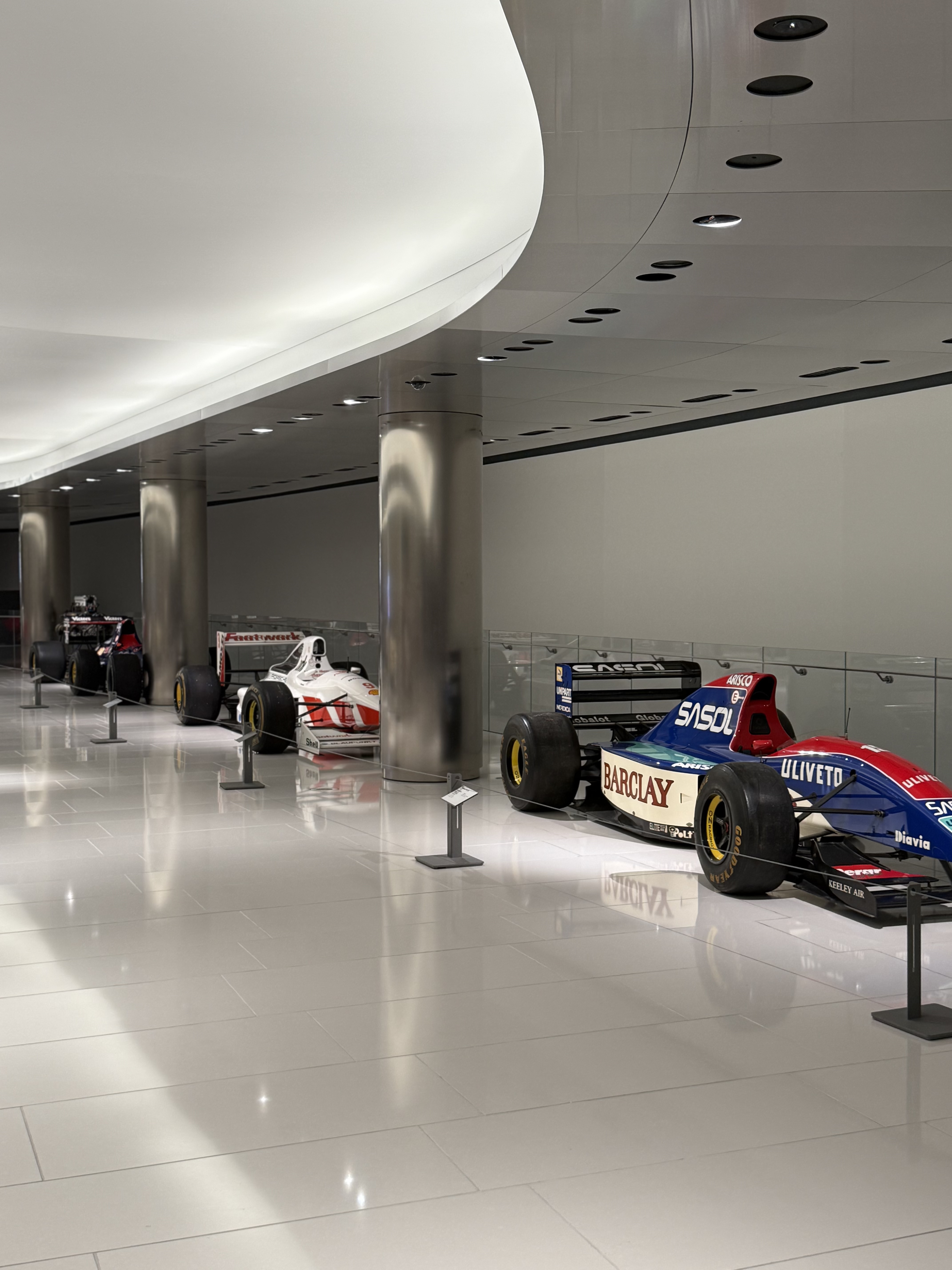 A row of vintage F1 cars in the museum