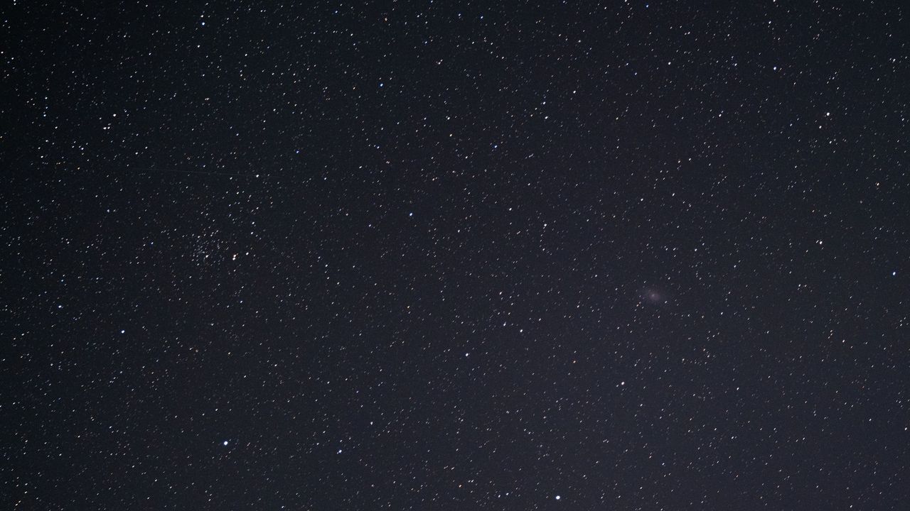 The Triangulum galaxy (M33) and NGC 752 in the night sky, as photographed by the Fujifilm GFX100S II.