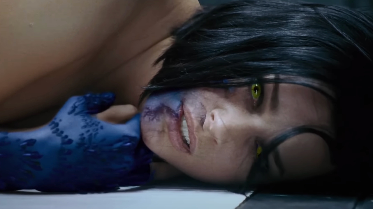 Rebecca Romijin looks scared as she transform into a human in X-Men: The Last Stand.