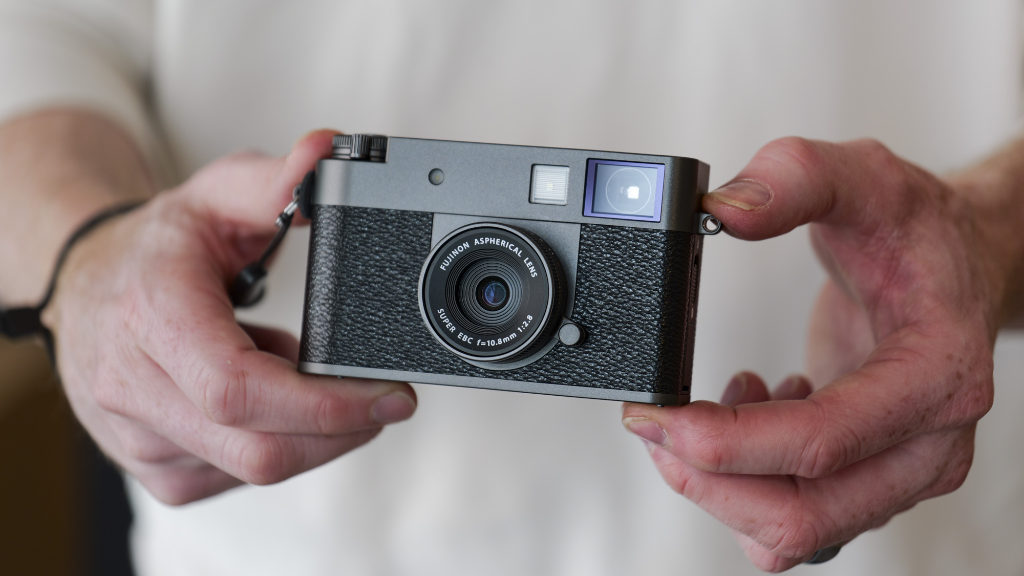 Fujifilm X half compact camera in the hand