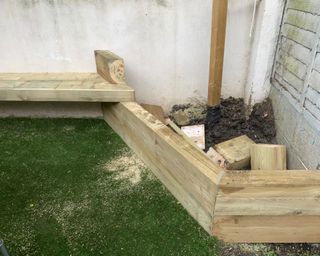 raised planters being made out of sleepers