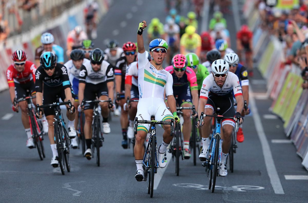 Caleb Ewan celebrates winning the Down Under Classic despite wearing the wrong skinsuit