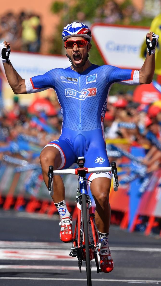 Nacer Bouhanni lets out a shout as he crosses the line