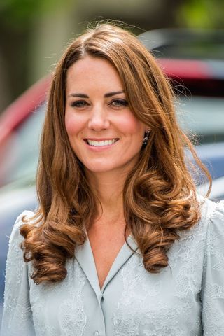 Kate Middleton headshot with a pincurl ends hairstyle