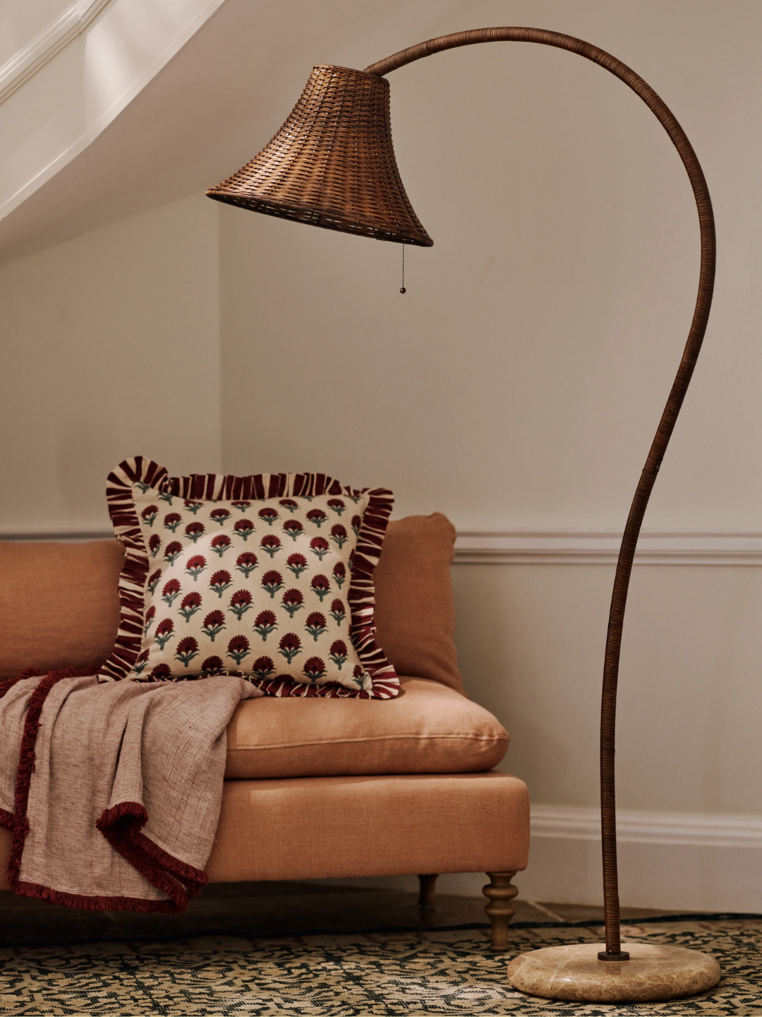 A woven floor lamp with a marble base from OKA