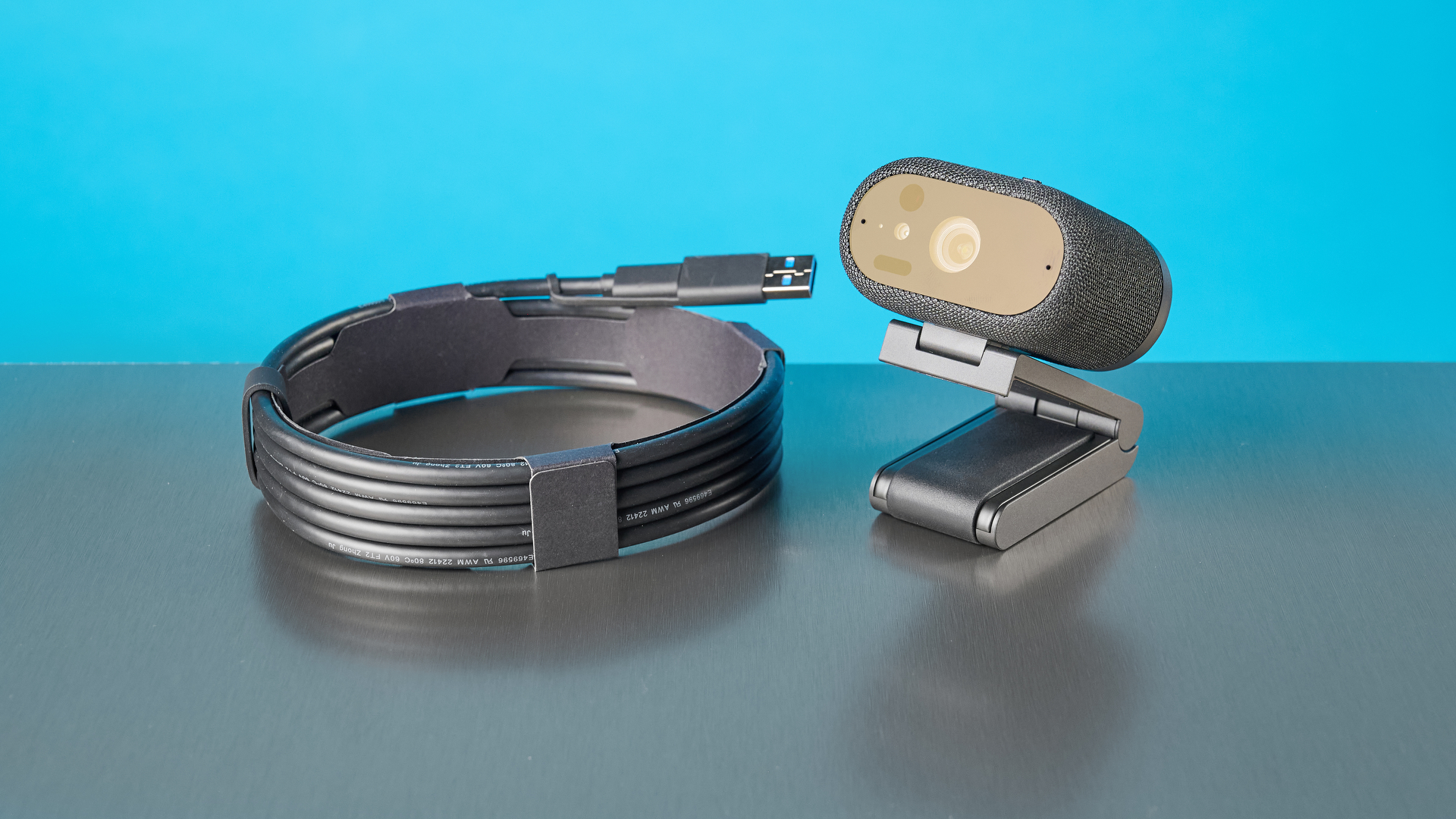 Dell Pro 7 Webcam photographed in front of a blue background