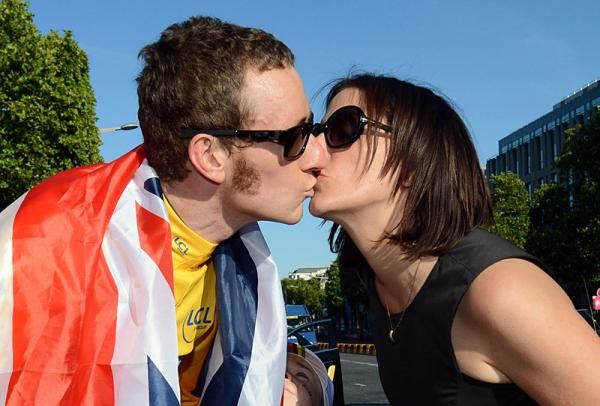 Newly crowned Tour de France champion Bradley Wiggins gets a kiss from his wife Catherine.