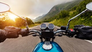 A POV photo of riding a motorcycle