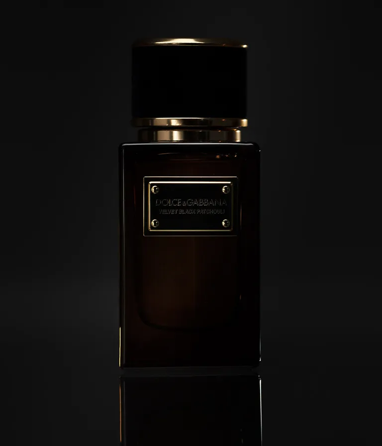 Dolce & Gabbana velvet black patchouli perfume in black bottle against black background