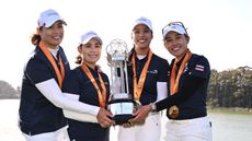 Team Thailand pose with the International Crown trophy 