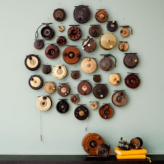 white wall with fishing reels