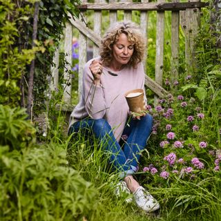 Kate Humble eating ice cream in a garden