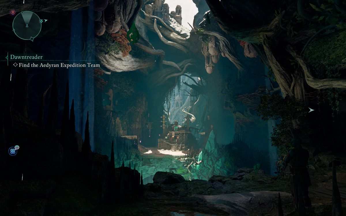 A screenshot of the interior of a large cave in Avowed.
