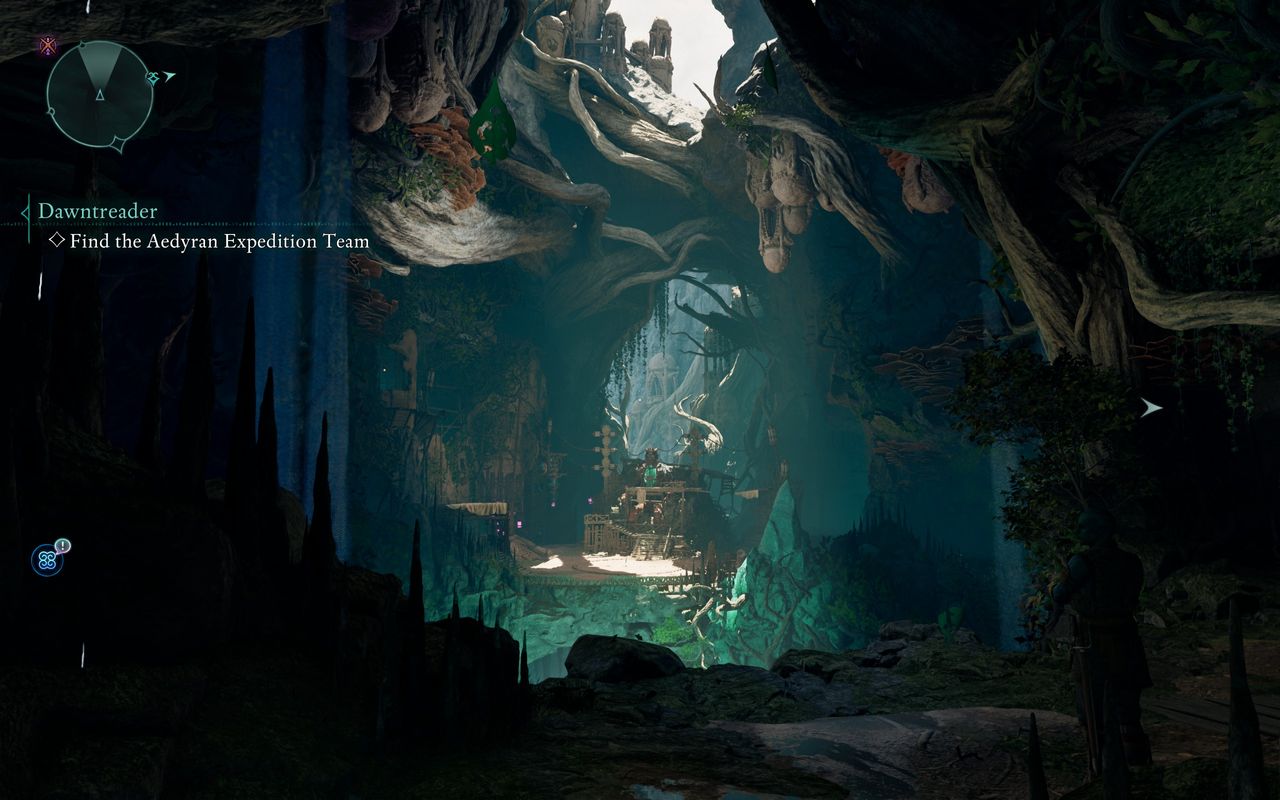 A screenshot of the interior of a large cave in Avowed.