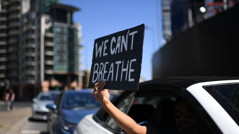 topshot a sign displaying the message we cant breathe is held out of a car window as demonstrators make their way towards the us embassy in central london on may 31, 2020 to protest the death of george floyd, an unarmed black man who died after a police officer knelt on his neck for nearly nine minutes during an arrest in minneapolis, usa hundreds of people gathered in central london to protest the death of george floyd, an unarmed black man who died while being arrested in minneapolis, usa photo by daniel leal olivas afp photo by daniel leal olivasafp via getty images