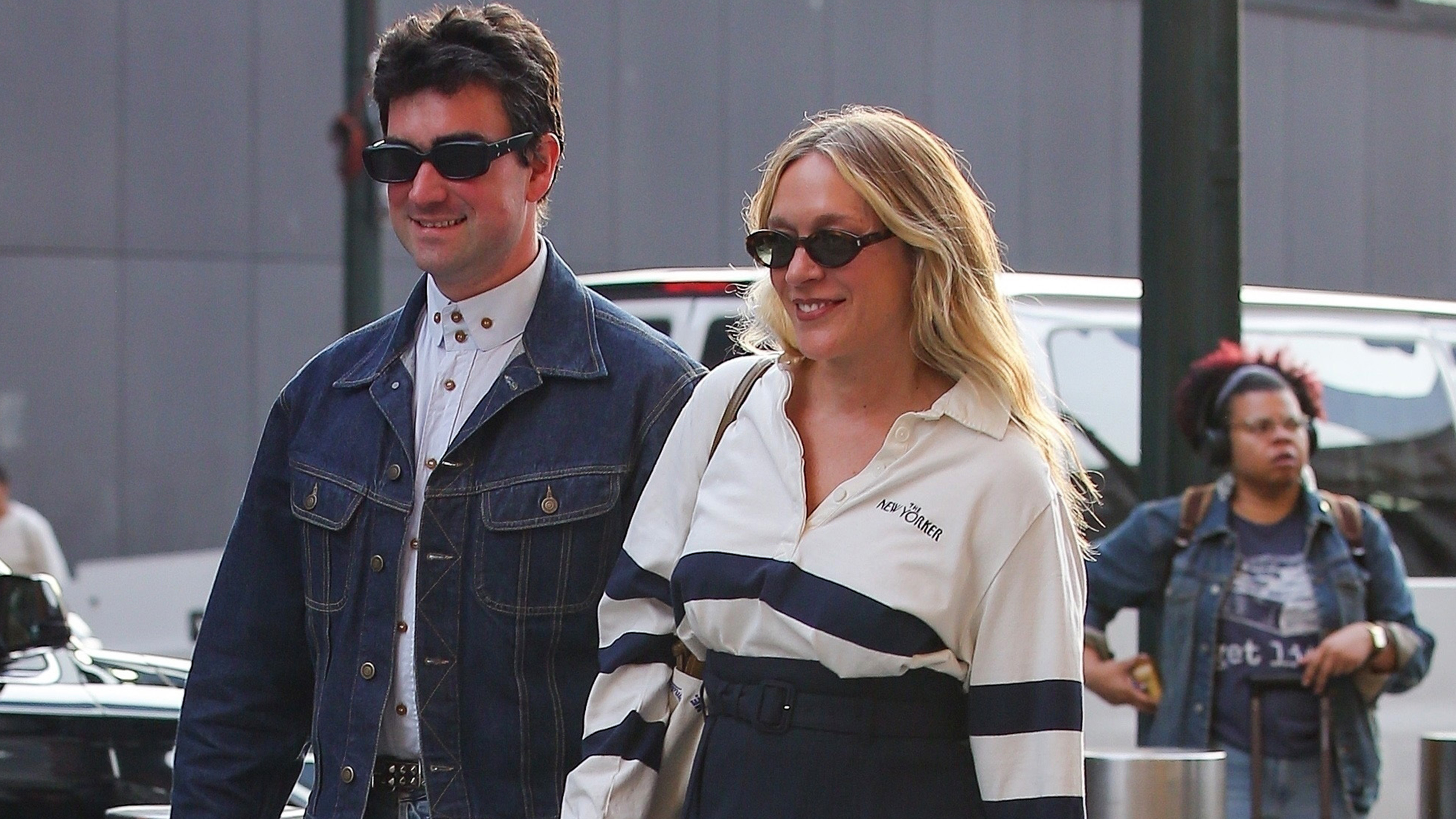 Chloë Sevigny is seen with husband Siniša Mačković in New York wearing shorts, black boots, and a J.Crew The New Yorker shirt, matching with a brown bag and a Knicks hat.