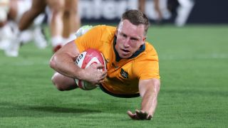 Harry Potter of Australia scores the team's first try against Japan