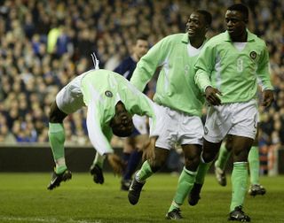 Julius Aghahowa celebrates a goal for Nigeria against Scotland in 2002.