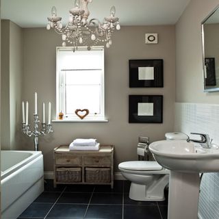 bathroom with white walls and western commode