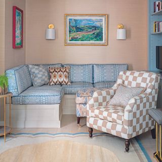 Living room with clashing patterns on armchair and sofa