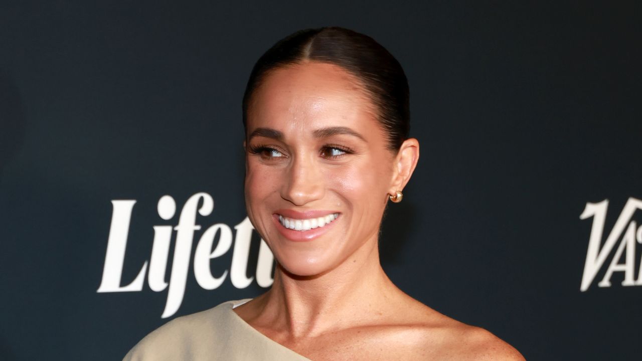 Meghan Markle wears a nude off the shoulder gown