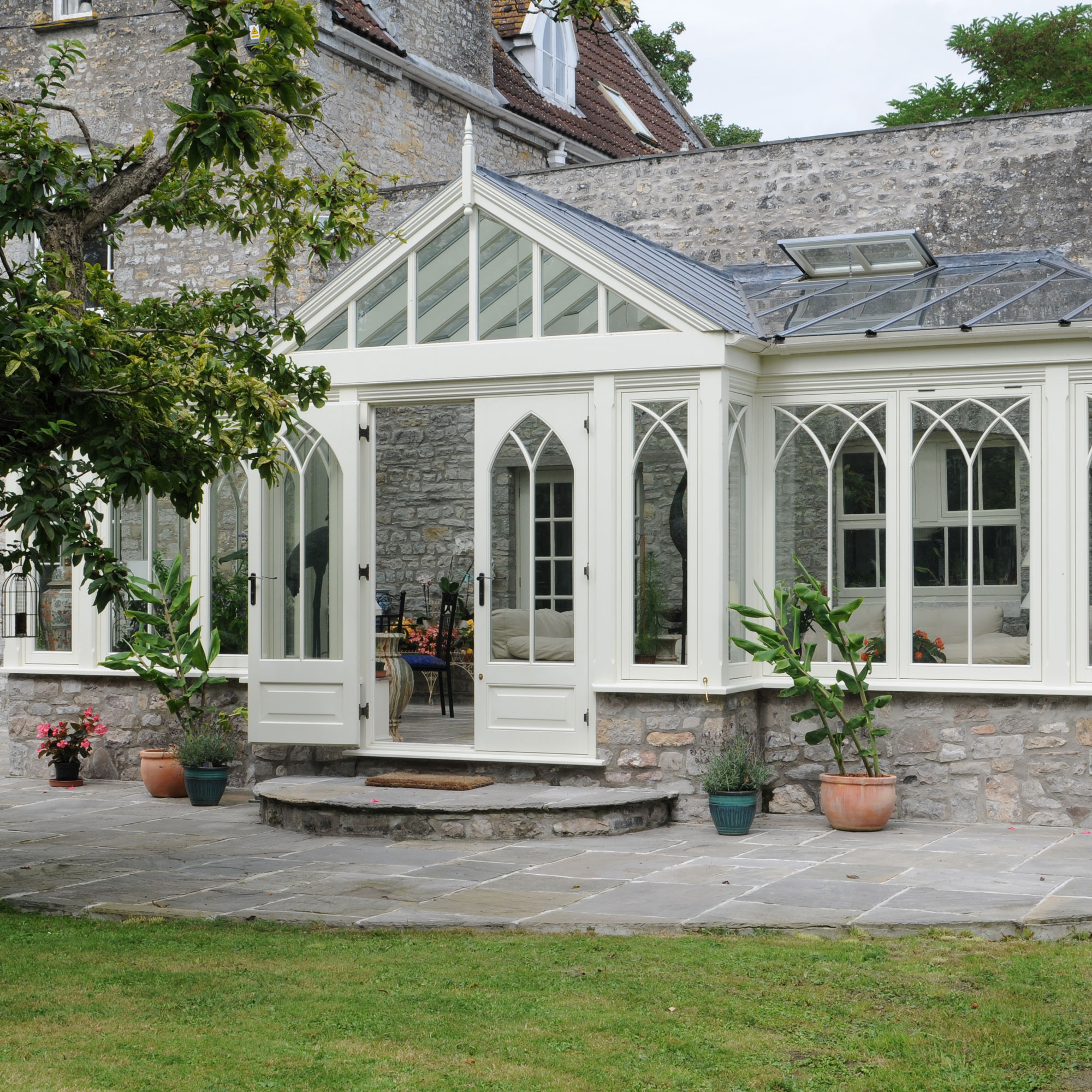 traditional timber conservatory on back of stone house