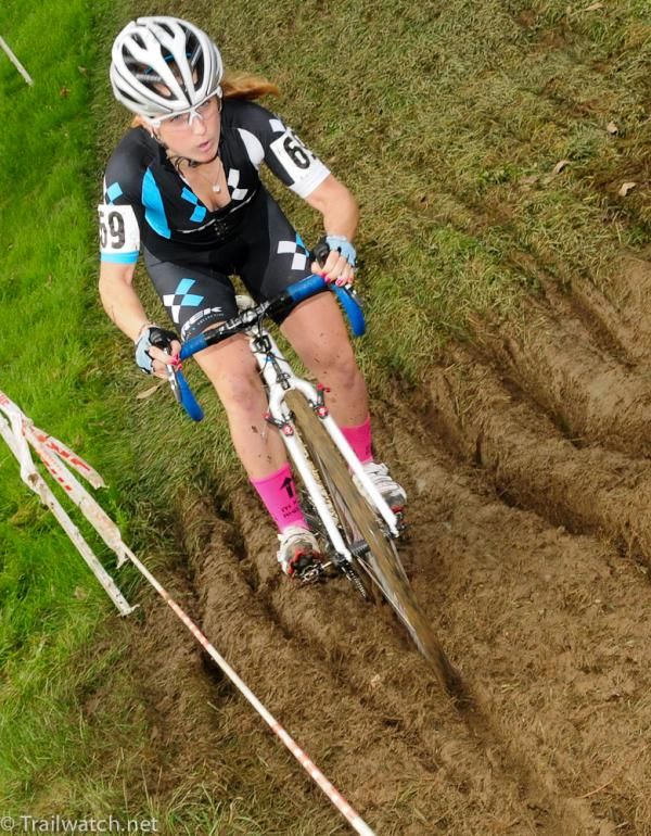 Ellen Noble (Trek Cyclocross Collective) following a track that would take her into the course tape.