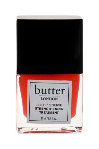 bottle of Butter London Jelly Preserve sheer orange Strengthening Treatment in strawberry rhubarb on white background 