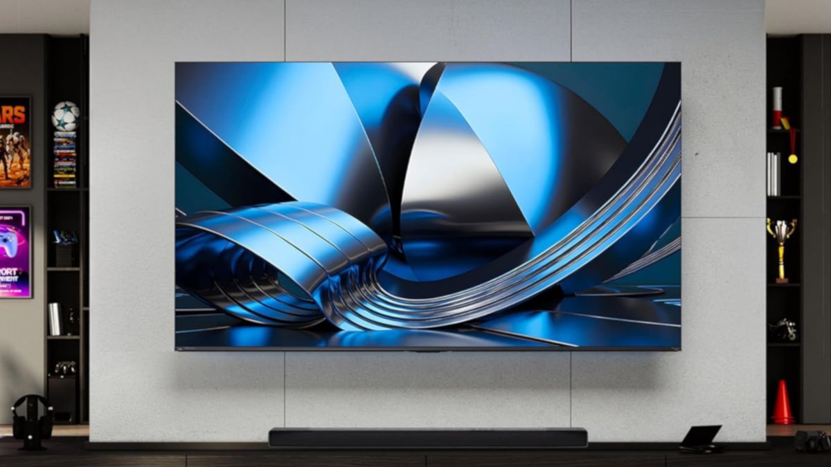 The Hisense U6SF Pro displaying abstract, blue-colored imagery in a wall-mounted position above a soundbar