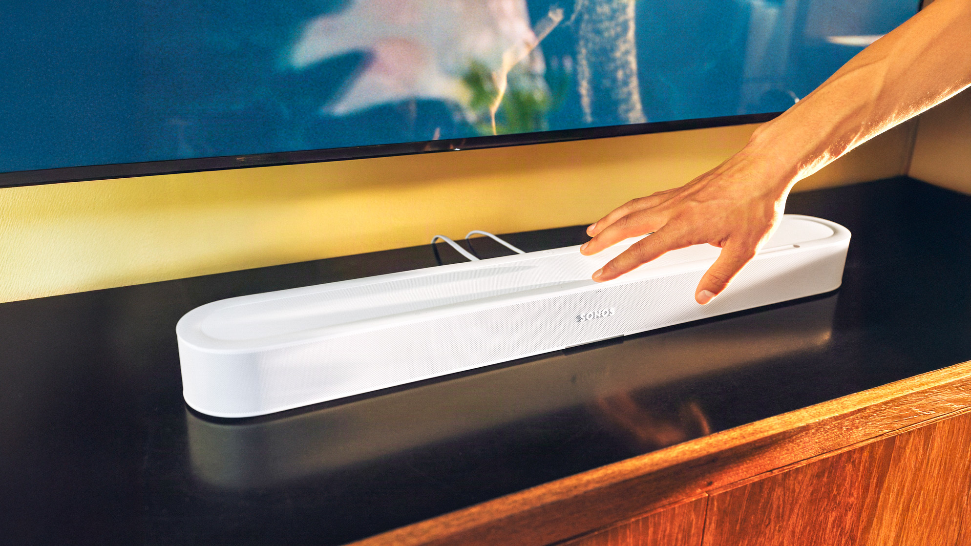 The new Sonos Beam Ultra on an entertainment center.