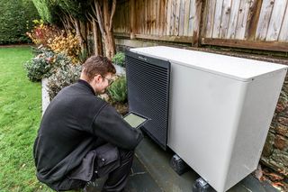 installing an air source heat pump in a garden