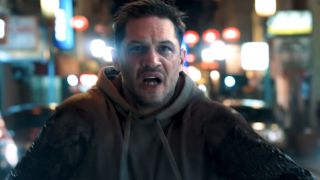 Screenshot of Eddie on motorcycle in car chase in Venom