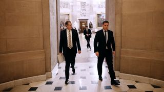House Select Committee On Intelligence Chairman Mike Turner (R-OH) (left) walks through the U.S. Capitol on Feb. 14, 2024 in Washington, DC.
