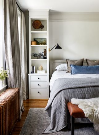 bedroom with floor to ceiling bedside table