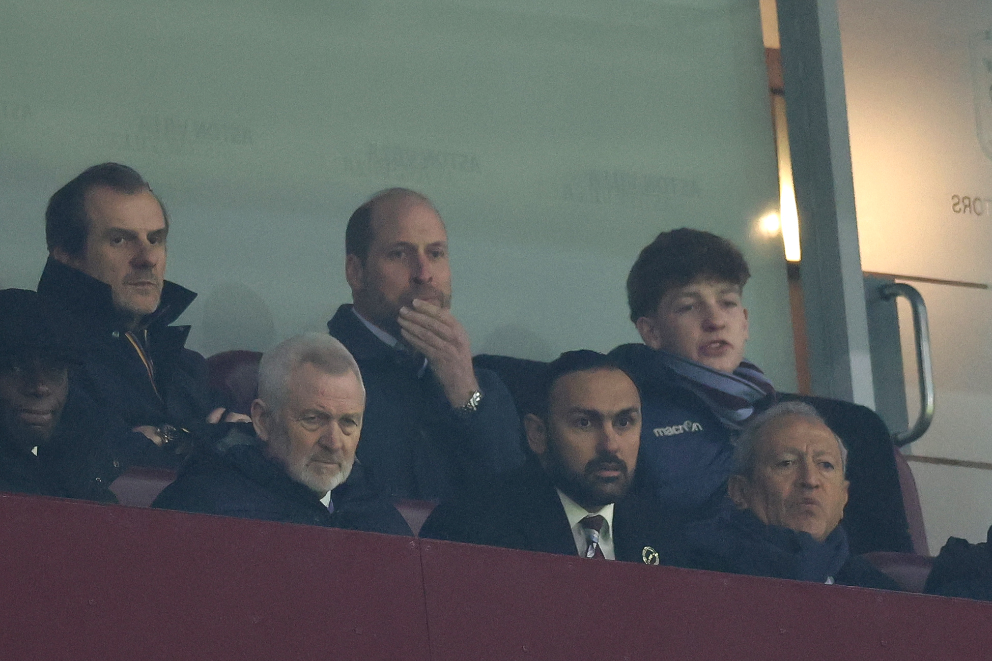 Britain's Prince William, Prince of Wales (top center) watches from the stands during the UEFA Europa League league-stage football match between Aston Villa and RB Salzburg