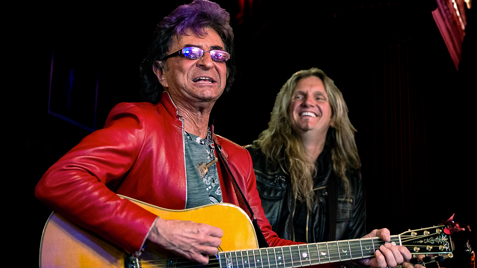 Jim Peterik from band Survivor attends attends "Rock Of Ages" 5th Anniversary On Broadway celebration at Helen Hayes Theatre on April 8, 2014 in New York City. Joel Hoekstra is standing behind him.