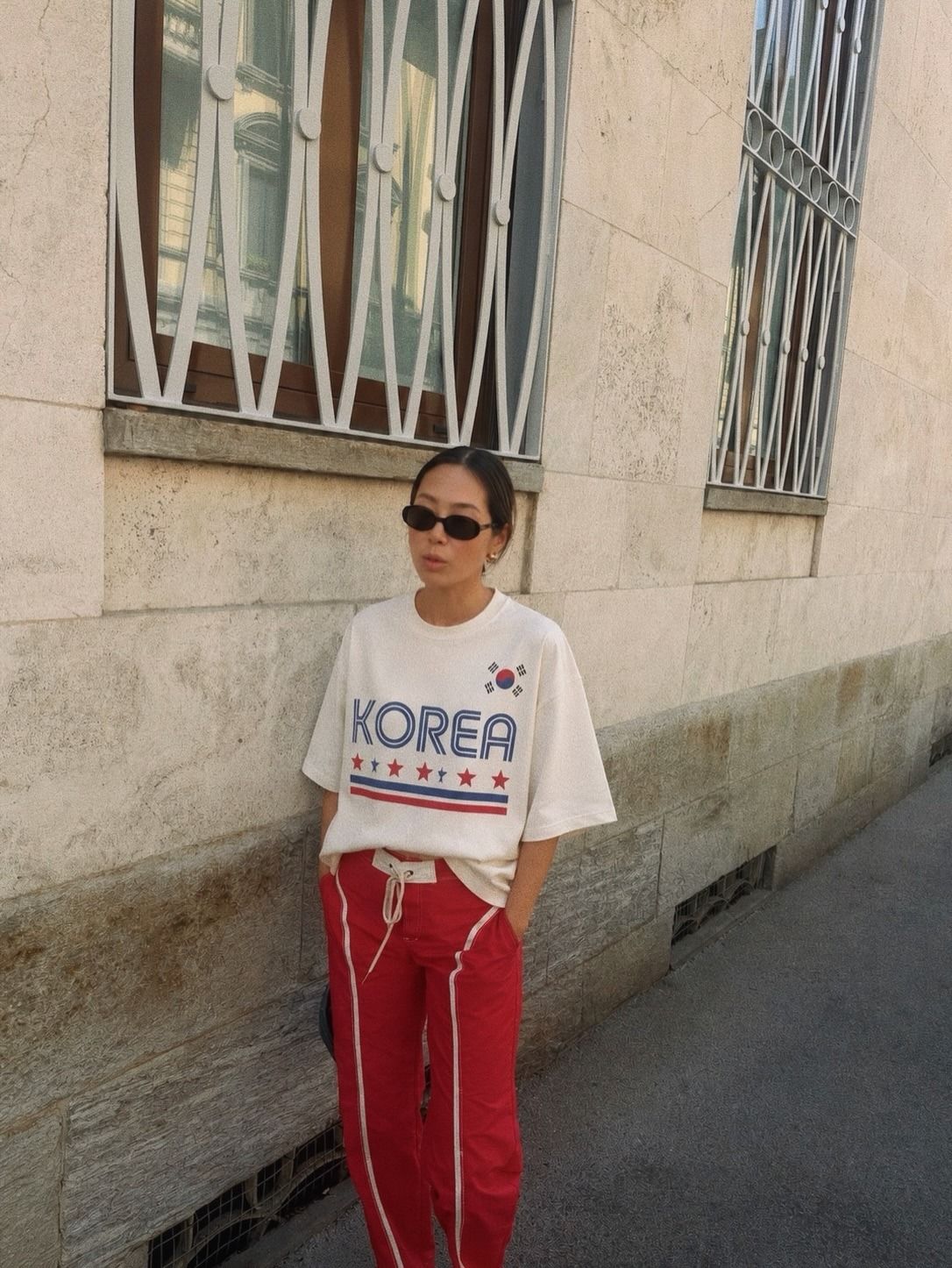 Influencer Aimee Song wearing a sporty T-shirt.