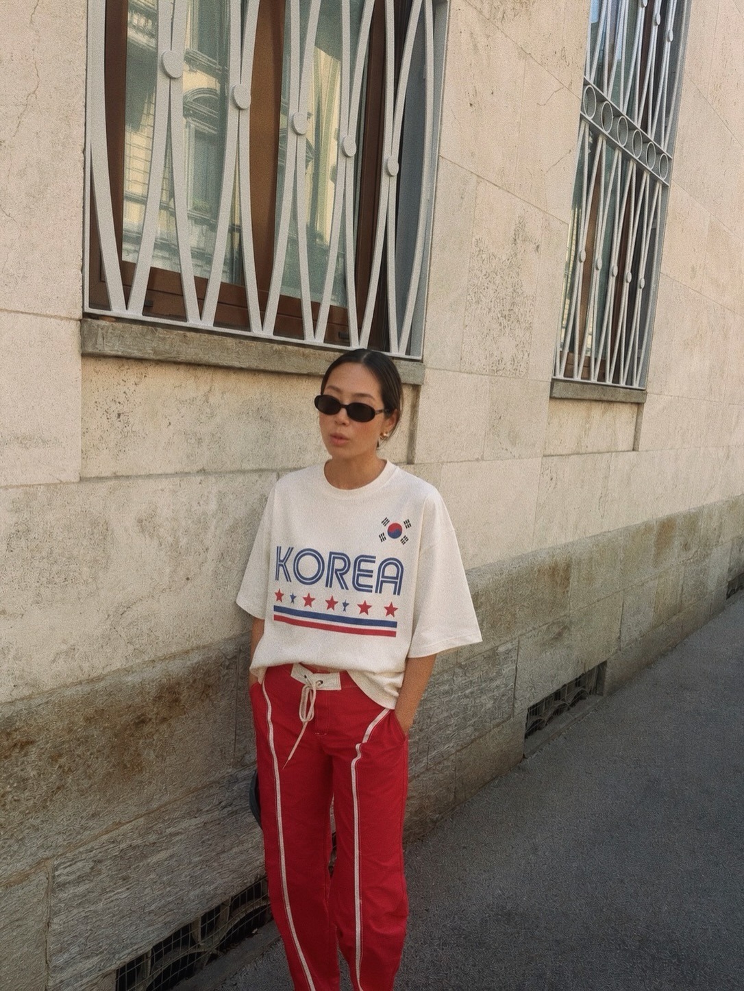 Influencer Aimee Song wearing a sporty T-shirt.