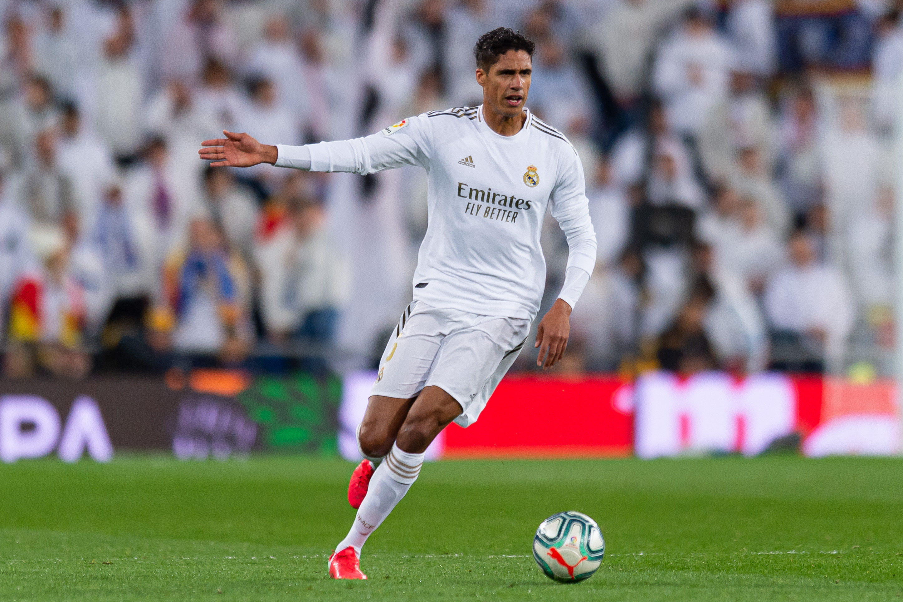Raphael Varane on the ball for Real Madrid against Barcelona in March 2020.