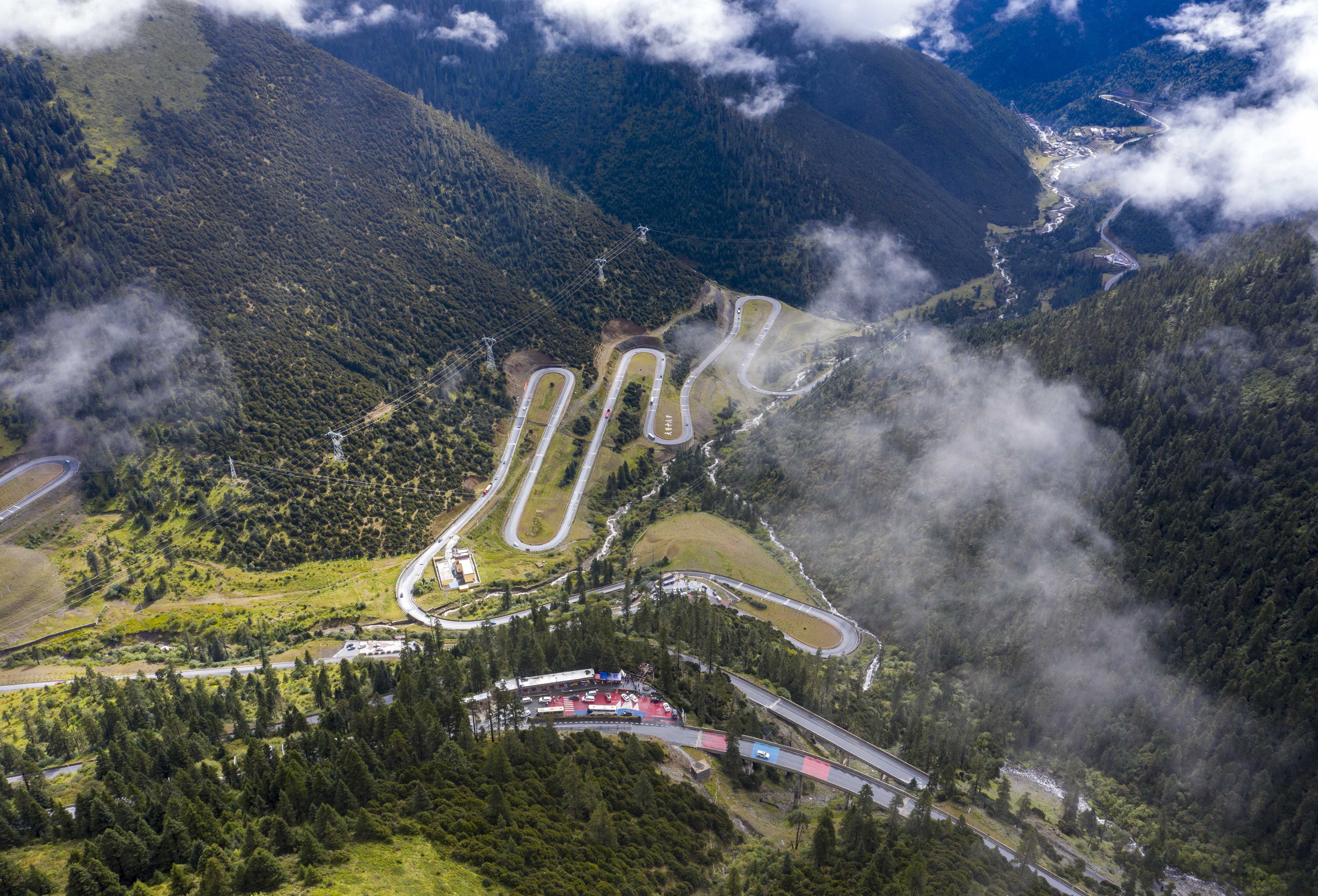The Sichuan-Tibet Highway bends in a mountainous region