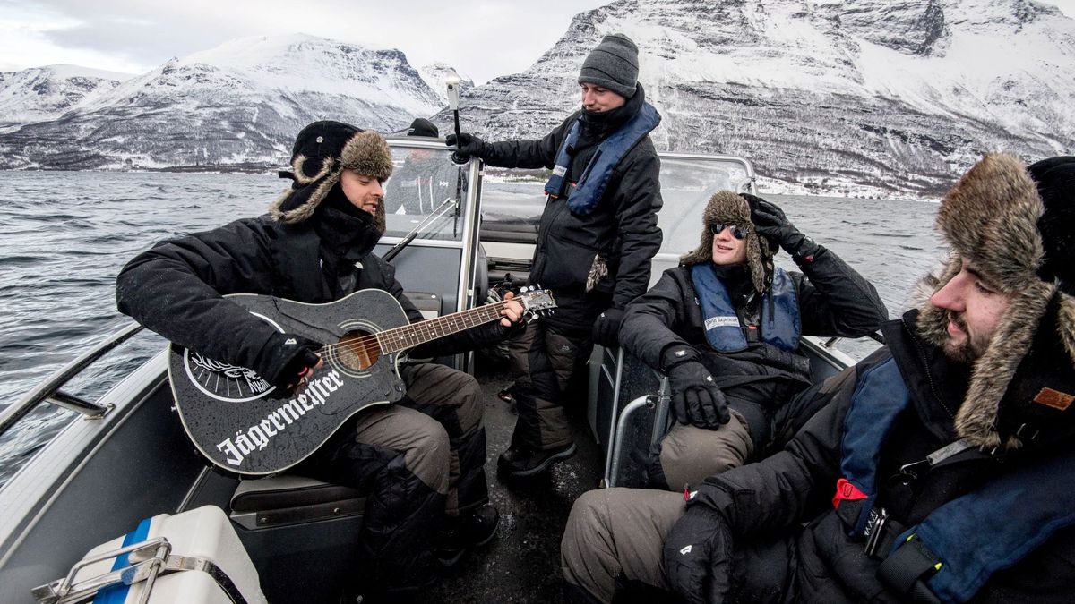 Matt Tuck plays the guitar as they speed across Lyngsfjord in a speedboat during Jagermeister&#039;s Ice Cold Gig, which became the world&#039;s first air, sea and land gig on March 11, 2016 in Lyngsfjord, Norway.