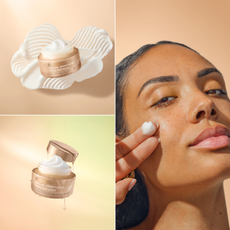 a woman with tan skin applying a white cream to her cheek