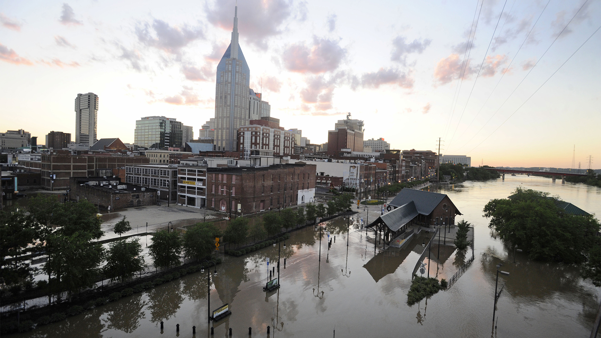 Buildings and city streets are still under floodwater as the sun sets on May 4, 2010 in Nashville, Tennessee. More than 13 inches of rain fell over two days, more than doubling the previous record of 6.68 inches and leaving as many as 10 dead and thousands displaced in Nashville.